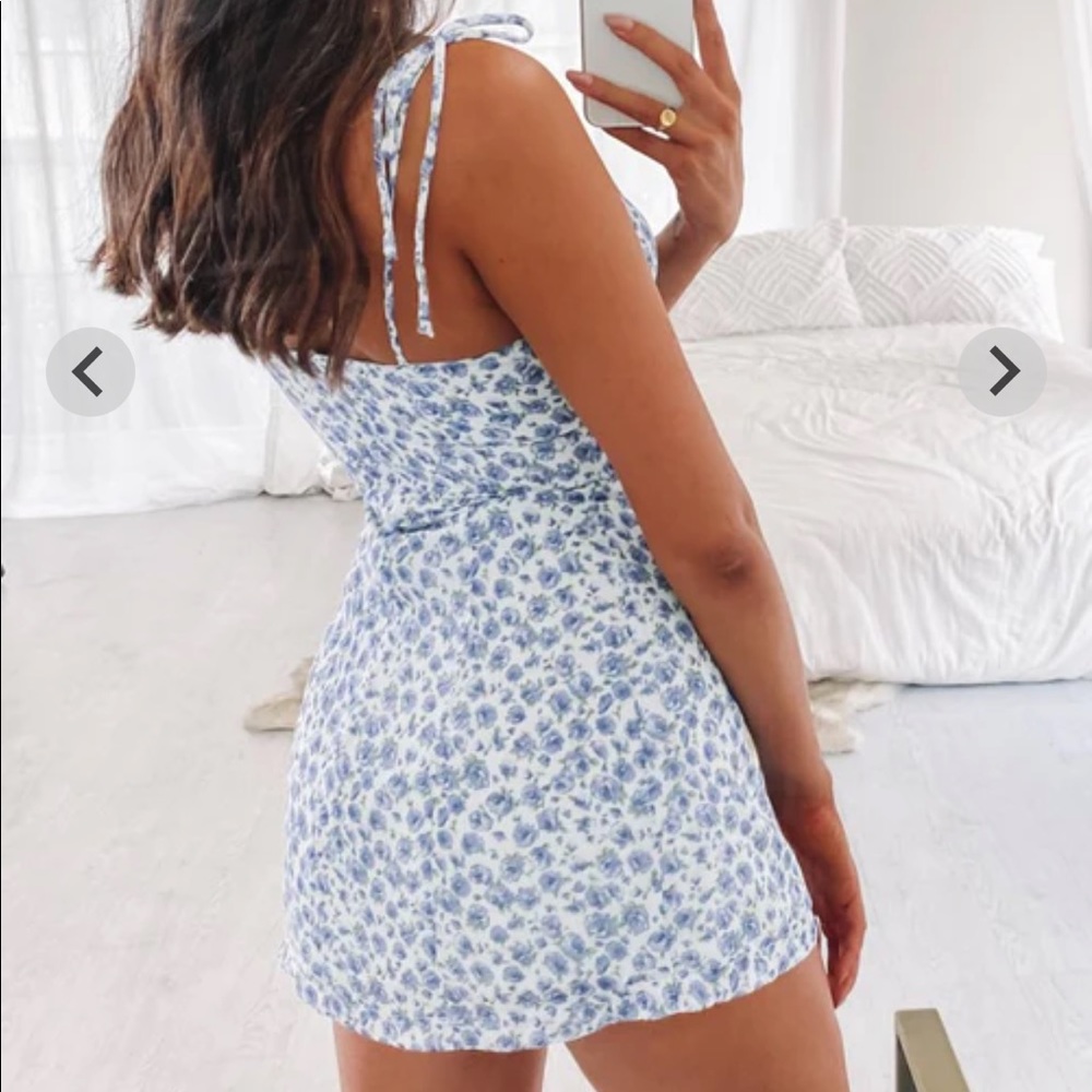 Beginning boutique mini dress that is floral (: